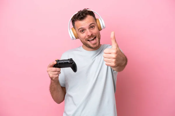 Young Brazilian Man Playing Video Game Controller Isolated Pink Background —  Fotos de Stock