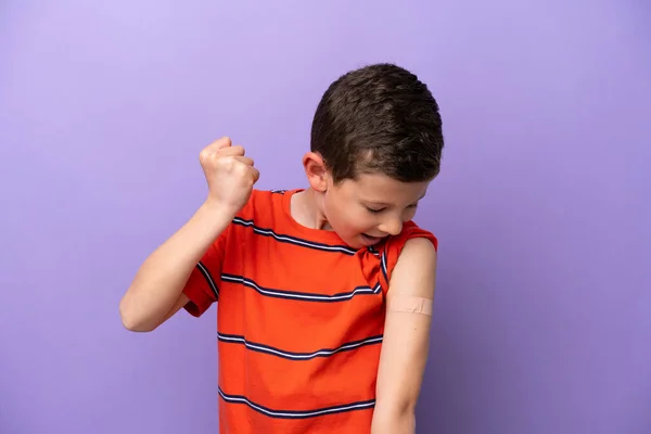 Little Boy Wearing Band Aid Isolated Purple Background Celebrating Victory — Stock Photo, Image