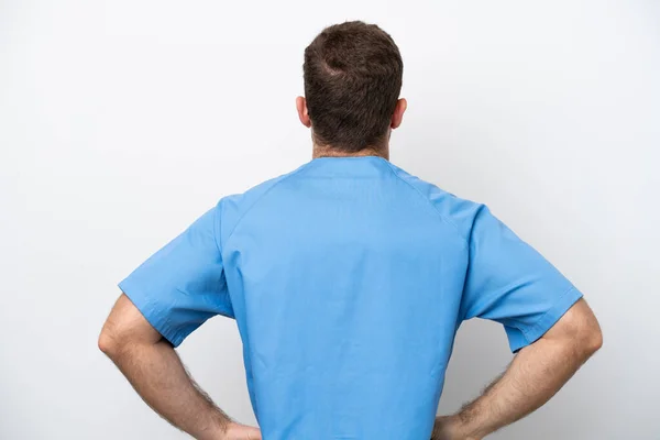 Young Surgeon Doctor Caucasian Man Isolated White Background Back Position — Zdjęcie stockowe