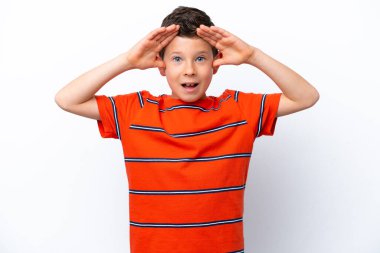 Little boy isolated on white background with surprise expression