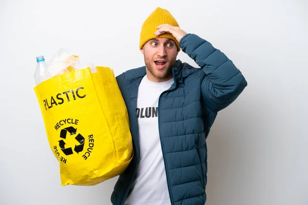 Young Caucasian Holding Bag Full Plastic Bottles Recycle Isolated White — стоковое фото