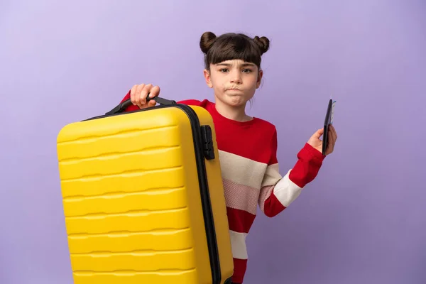 Little Caucasian Girl Isolated Purple Background Unhappy Vacation Suitcase Passport — Stock Photo, Image