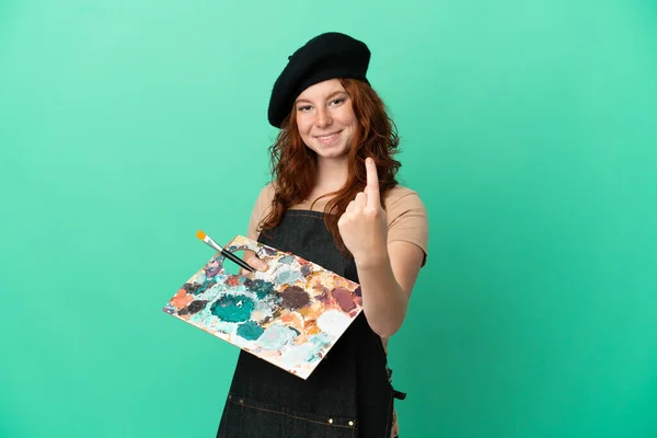 Teenager Redhead Artist Holding Palette Isolated Green Background Doing Coming — Stock Photo, Image