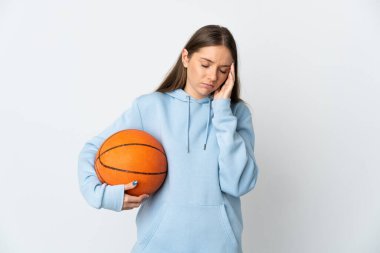 Young Lithuanian woman playing basketball isolated on white background with headache