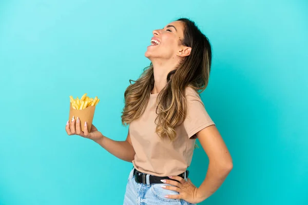 Young Woman Holding Fried Chips Isolated Background Laughing Lateral Position — Stock Fotó
