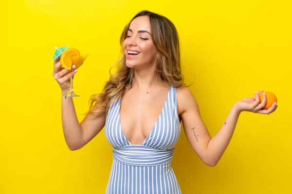 Young Caucasian Woman Isolated Yellow Background Swimsuit Holding Cocktail — Foto Stock