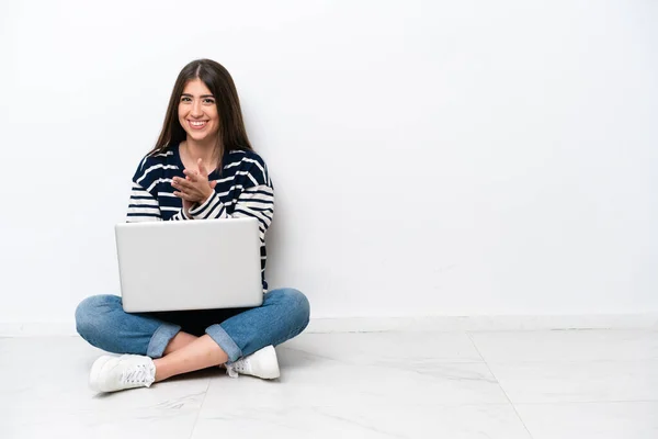 Young Caucasian Woman Laptop Sitting Floor Isolated White Background Applauding — стоковое фото