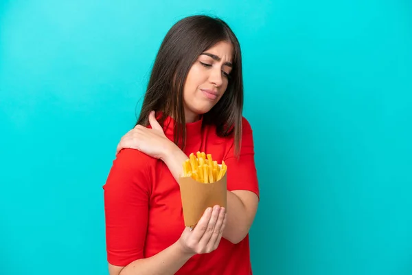 Young Caucasian Woman Catching French Fries Isolated Blue Background Suffering — Foto Stock