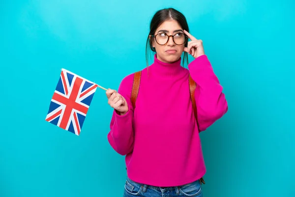Young Caucasian Student Woman Holding English Flag Isolated Blue Background — 스톡 사진