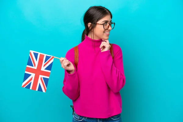 Young Caucasian Student Woman Holding English Flag Isolated Blue Background — Stock fotografie