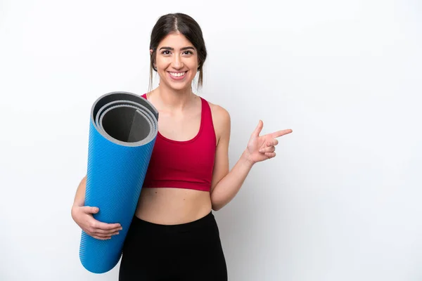 Young Sport Woman Going Yoga Classes While Holding Mat Isolated — ストック写真