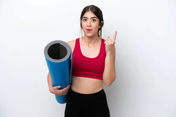 Young Sport Woman Going Yoga Classes While Holding Mat Isolated — ストック写真