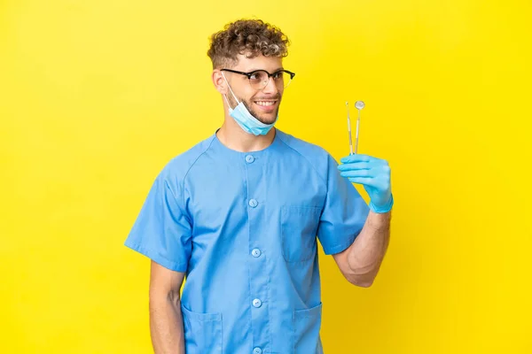 Dentist Blonde Man Holding Tools Isolated Background Thinking Idea While — 스톡 사진