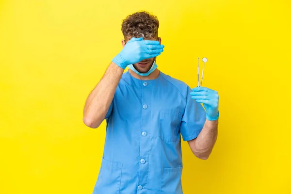 Dentist Blonde Man Holding Tools Isolated Background Covering Eyes Hands — Zdjęcie stockowe