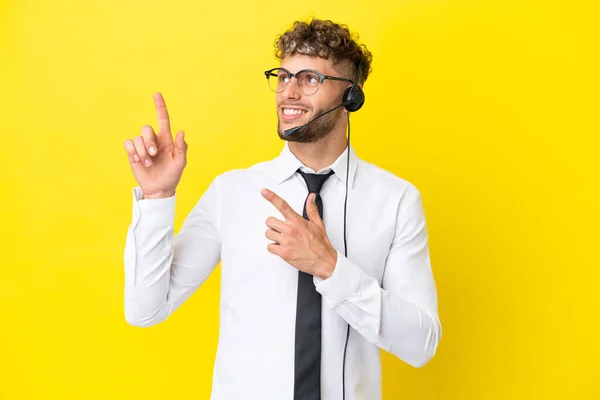 Telemarketer Blonde Man Working Headset Isolated Yellow Background Pointing Index — 스톡 사진