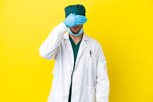 Surgeon Blonde Man Green Uniform Isolated Yellow Background Covering Eyes — 스톡 사진