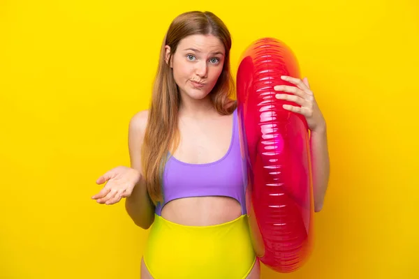 Young Caucasian Woman Holding Air Mattress Isolated Yellow Background Making — Foto de Stock