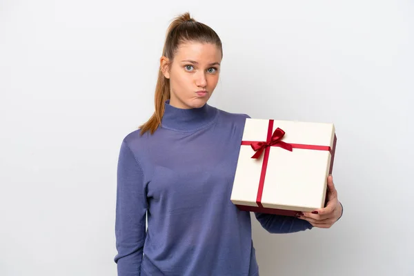 Young Caucasian Woman Holding Gift Isolated White Background Sad Expression — 스톡 사진