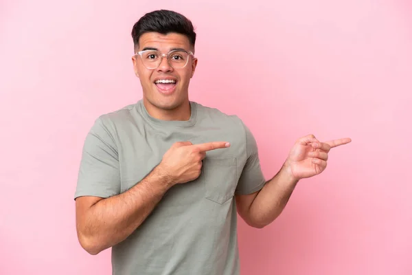 Young Caucasian Handsome Man Isolated Pink Background Surprised Pointing Side —  Fotos de Stock