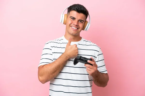 Young Handsome Man Playing Video Game Controller Isolated Pink Background — 图库照片