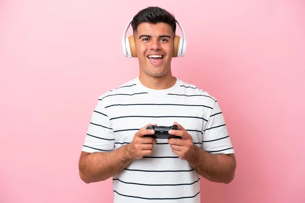 Young Handsome Man Playing Video Game Controller Isolated Pink Background — Stockfoto