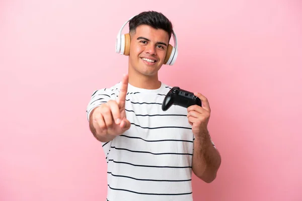 Young Handsome Man Playing Video Game Controller Isolated Pink Background — 스톡 사진