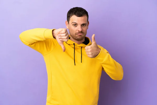 Brazilian Man Isolated Purple Background Making Good Bad Sign Undecided — 스톡 사진
