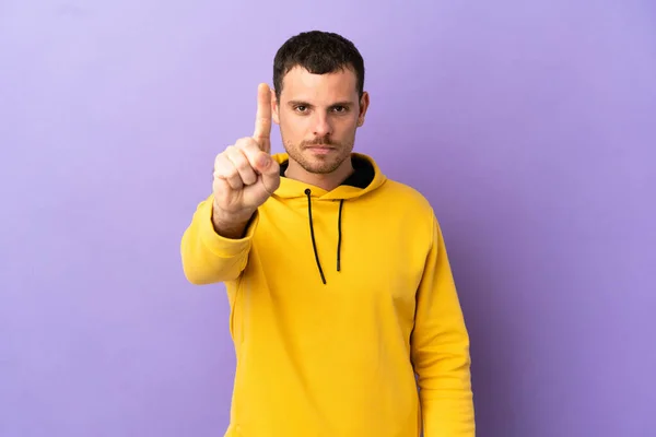 Brazilian Man Isolated Purple Background Counting One Serious Expression — Zdjęcie stockowe