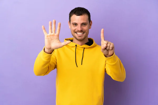 Brazilian Man Isolated Purple Background Counting Six Fingers — Stockfoto