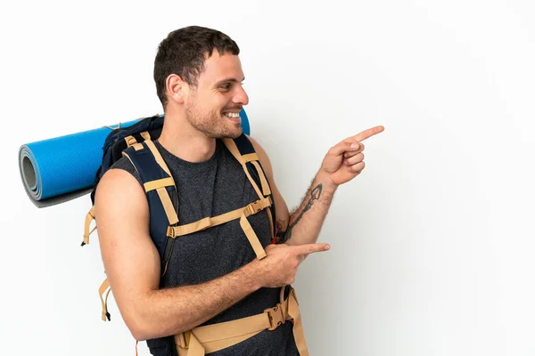 Brazilian Mountaineer Man Big Backpack Isolated White Background Pointing Finger — Stockfoto