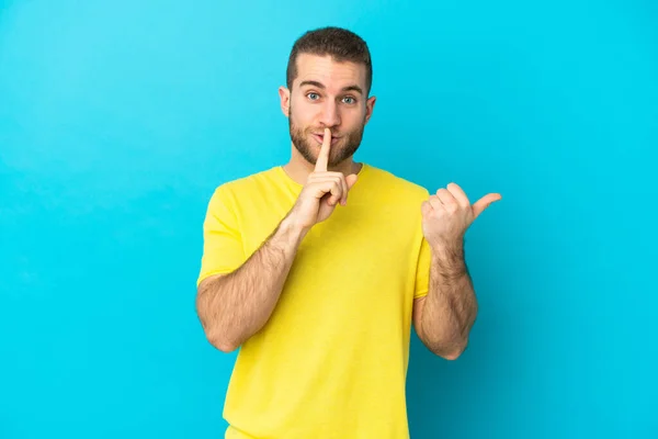 Young Handsome Caucasian Man Isolated Blue Background Pointing Side Doing — kuvapankkivalokuva