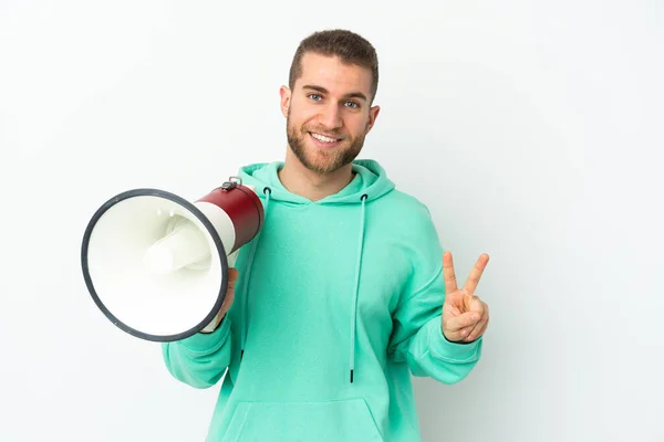 Young Handsome Caucasian Man Isolated White Background Holding Megaphone Smiling — стоковое фото