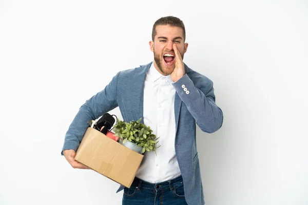 Young Caucasian Making Move While Picking Box Full Things Isolated — Stockfoto