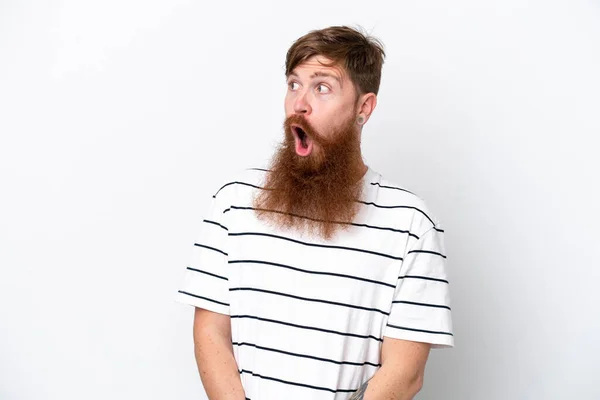 Redhead Man Beard Isolated White Background Doing Surprise Gesture While —  Fotos de Stock