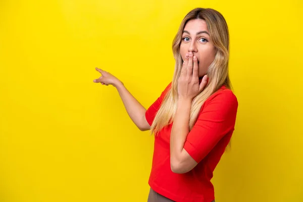Young Uruguayan Woman Isolated Yellow Background Surprise Expression While Pointing —  Fotos de Stock