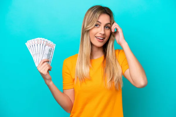 Young Uruguayan Woman Taking Lot Money Isolated Blue Background Thinking — Stock Photo, Image