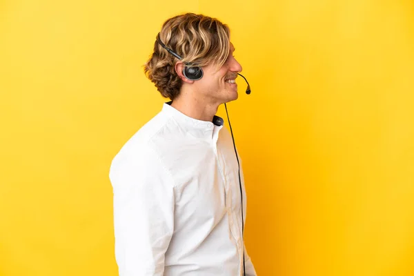 Telemarketer Man Working Headset Isolated Yellow Background Looking Side — стоковое фото