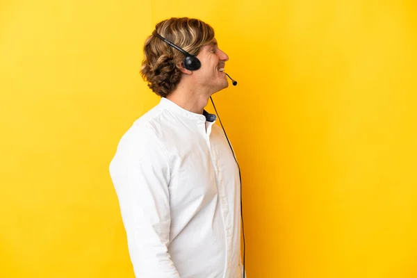 Telemarketer Man Working Headset Isolated Yellow Background Laughing Lateral Position — стоковое фото