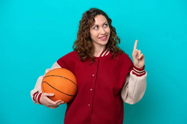 Young Caucasian Basketball Player Woman Isolated Blue Background Pointing Great — Stock Photo, Image