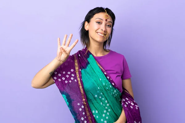 Indian Woman Isolated Purple Background Happy Counting Four Fingers — стоковое фото