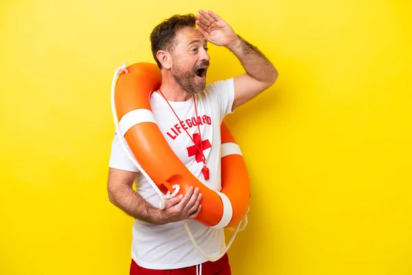 Lifeguard Middle Age Man Isolated Yellow Background Doing Surprise Gesture — 스톡 사진