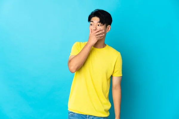 Young Chinese Man Isolated Blue Background Doing Surprise Gesture While — Stok fotoğraf