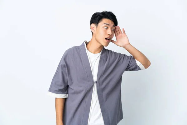 Young Chinese Man Isolated White Background Listening Something Putting Hand — 스톡 사진