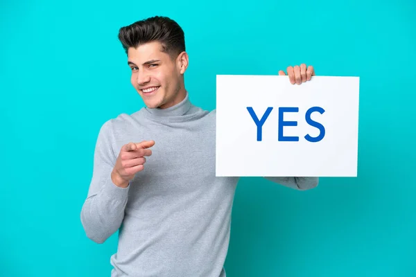 Young Handsome Caucasian Man Isolated Blue Bakcground Holding Placard Text — Stock Fotó