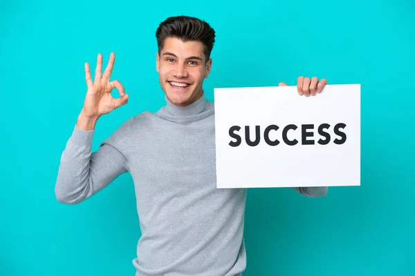 Young Handsome Caucasian Man Isolated Blue Bakcground Holding Placard Text — Stock Photo, Image