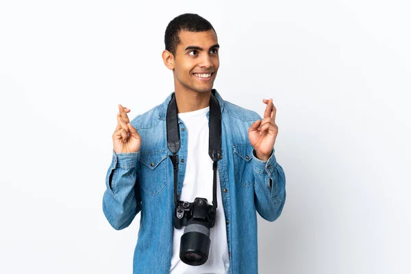Young African American Photographer Man Isolated White Background Fingers Crossing — Stockfoto