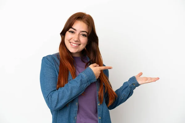 Young Redhead Woman Isolated White Background Holding Copyspace Imaginary Palm — Stockfoto
