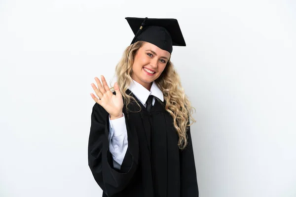 Młoda Absolwentka Uniwersytetu Odizolowana Białym Tle Salutująca Ręką Szczęśliwym Wyrazem — Zdjęcie stockowe