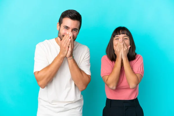 Young Couple Isolated Blue Background Smiling Lot While Covering Mouth — Stock fotografie