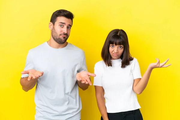 Young Couple Isolated Yellow Background Unhappy Frustrated Something Because Understand — Foto Stock